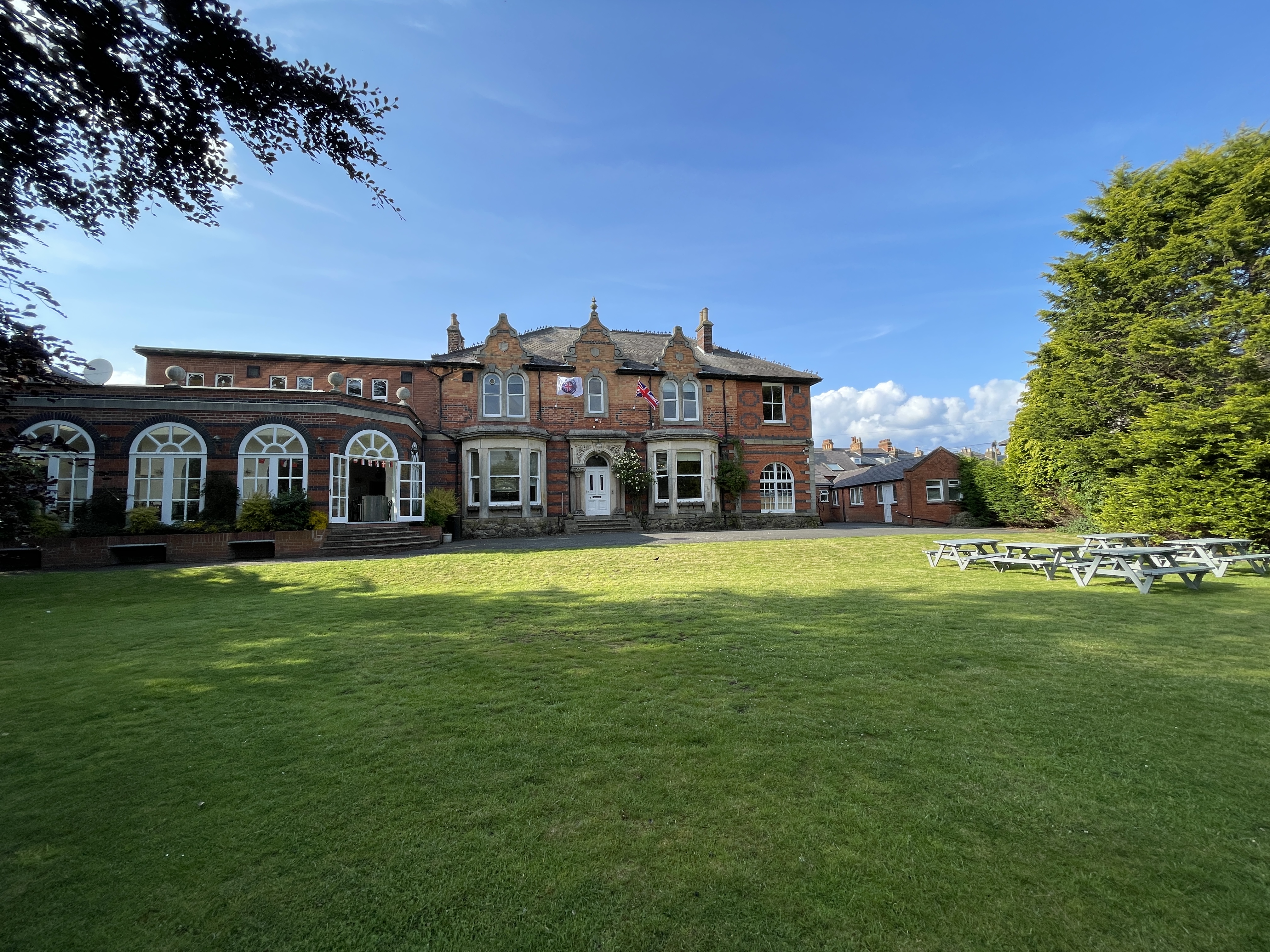 Anglotec Academy campus — Victorian building with lawn